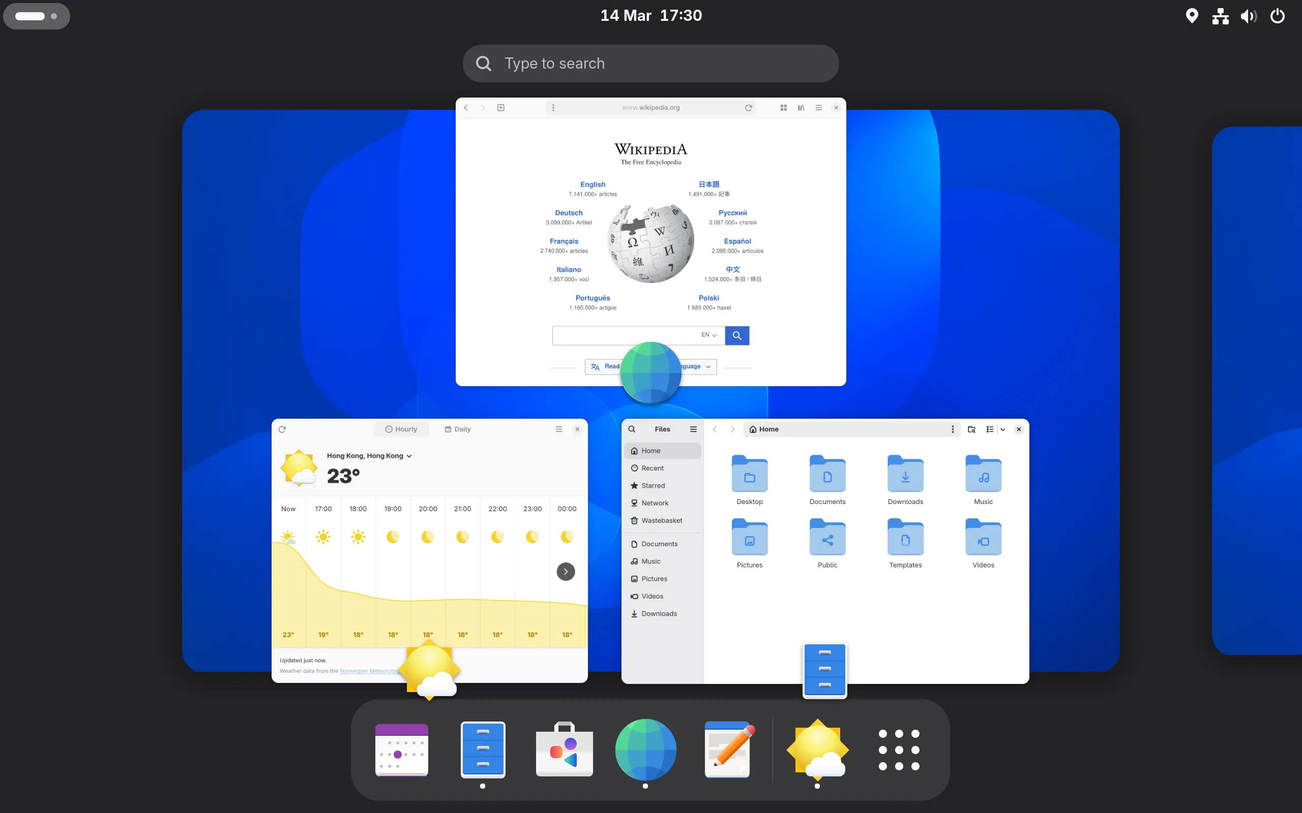 GNOME Activities overview with a search bar, open windows and an app dock along the bottom.